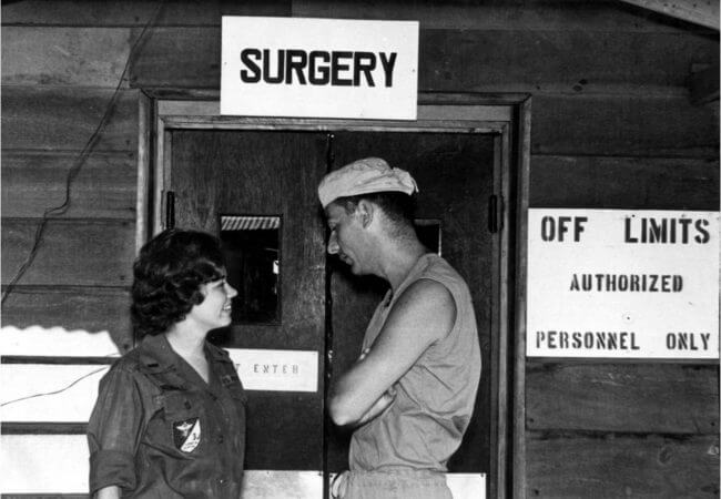 Karren Kowalski discusses a patient's condition with a surgeon