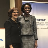 Congresswoman Suzanne Bonamici (OR), left, joins Underwood at the podium.